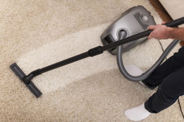 24476462 - close up of vacuuming a carpet