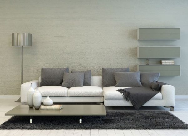 36673029 - modern grey and white living room with floor lamp, sofa, coffee table, and floating shelves