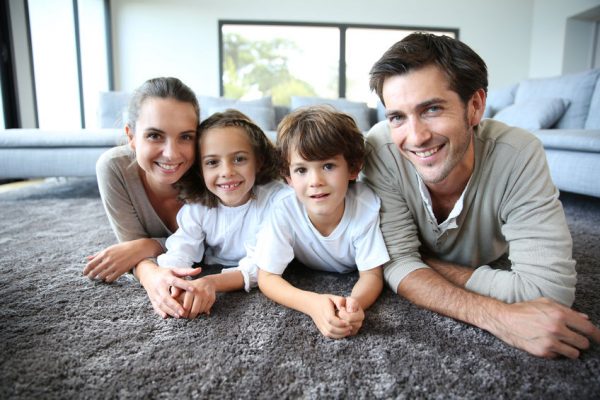 23365185 - family at home relaxing on carpet