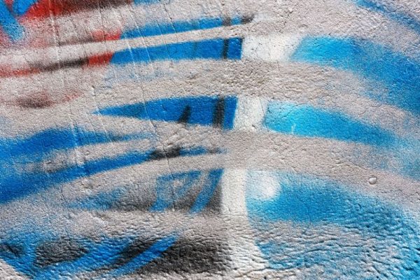 36099566 - abstract colorful graffiti background painted on concrete wall